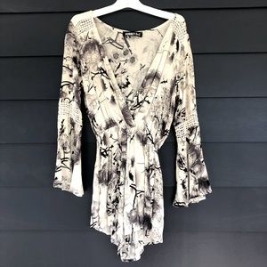 Long sleeved black and white floral romper